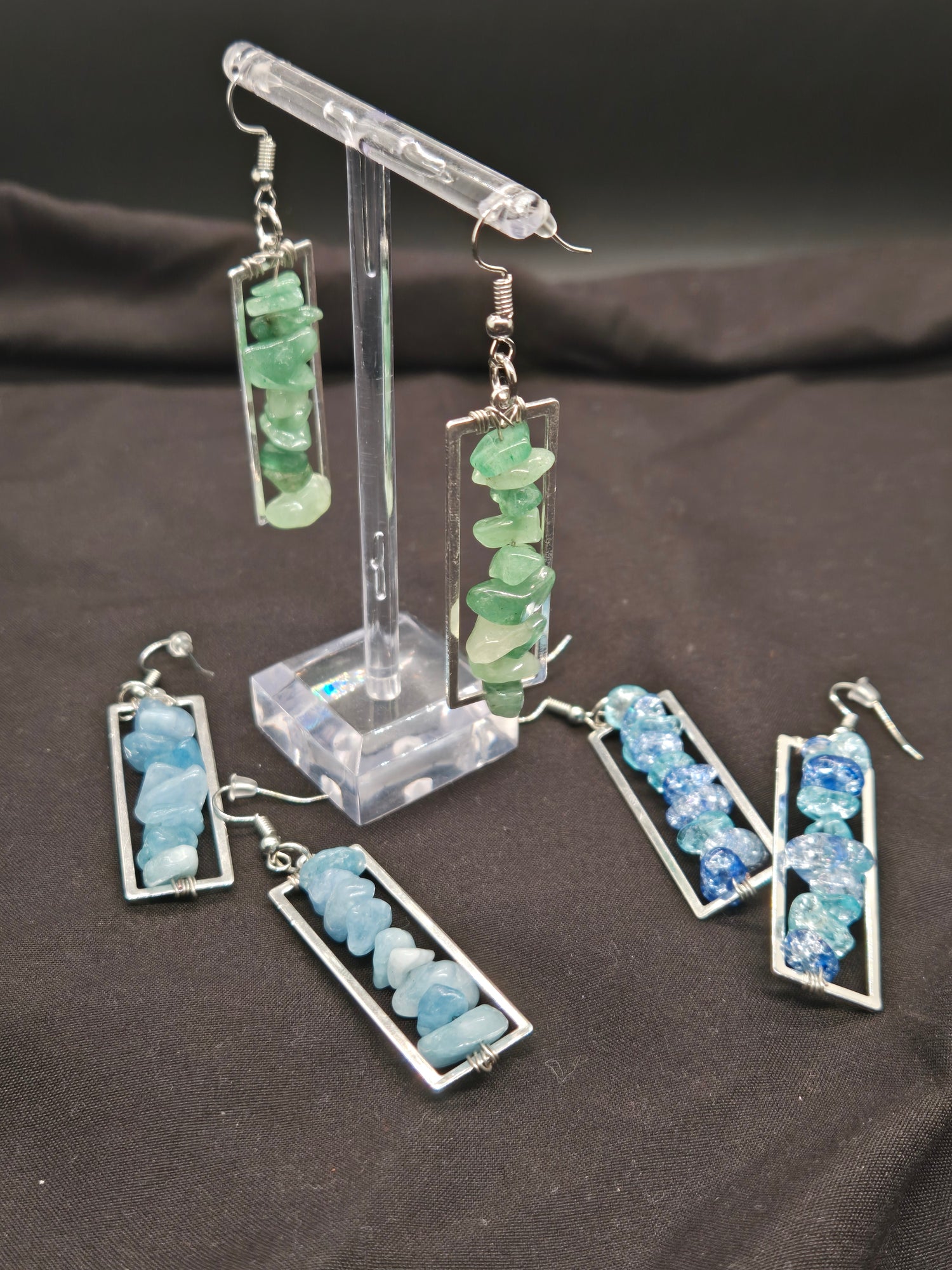 Set of earrings with chip beads on a dark background