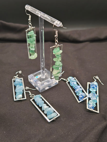 Set of earrings with chip beads on a dark background